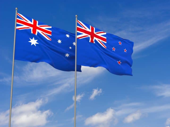 New Zealand and Australia flags over blue sky background. 3D illustration
