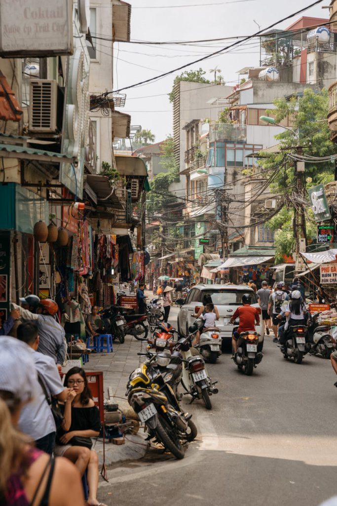 people sitting on sidewalk